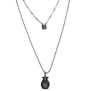 Double layered grey blue stones in silvered colored metal setting. The Buckle